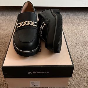 BCBG black loafers with gold chain accent